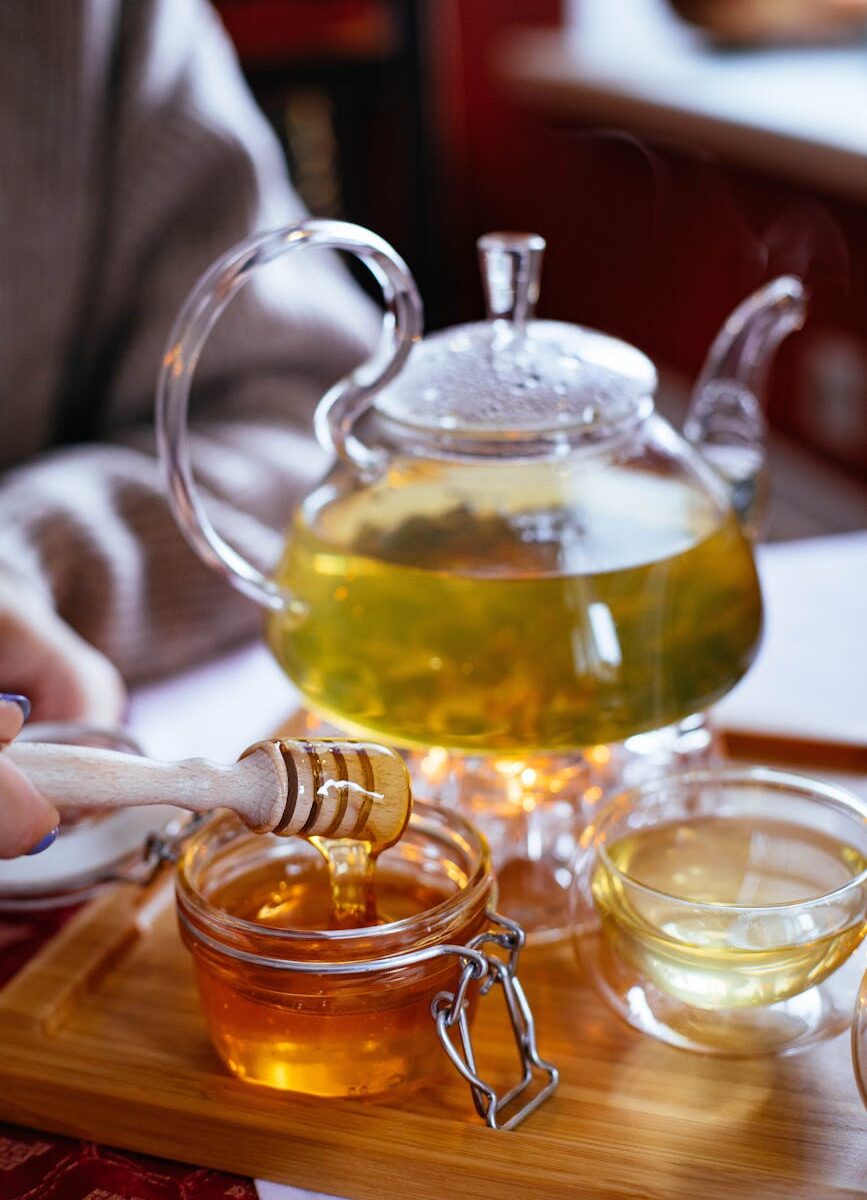 clear glass tea set with honey
