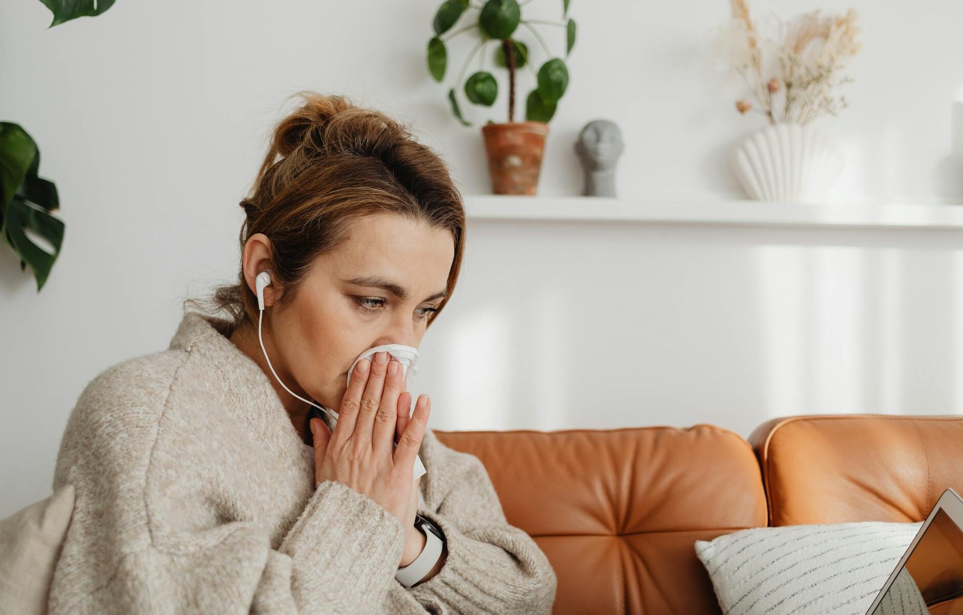 woman blowing nose